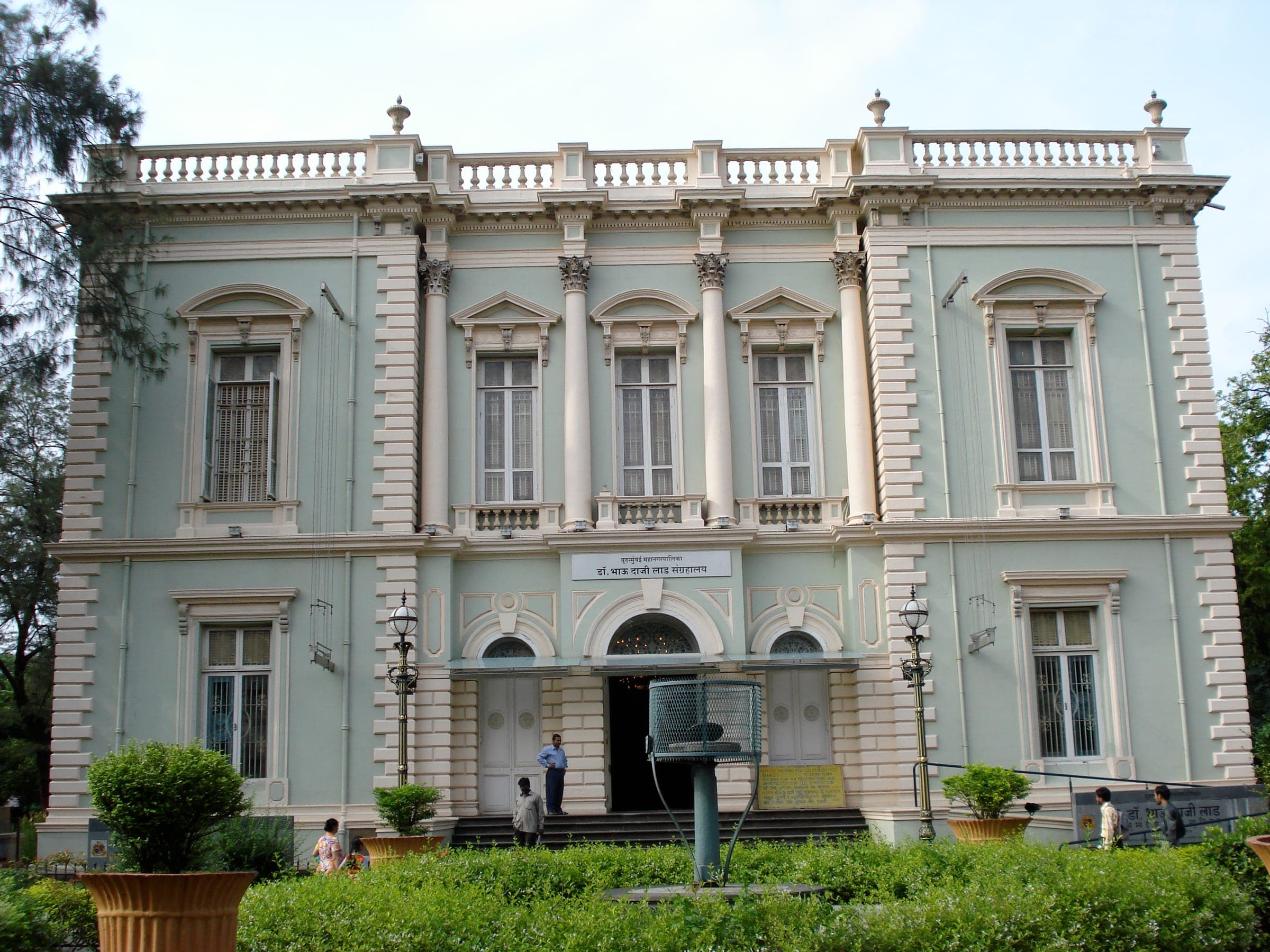 The pale green and cream front of the Dr. Bhau Daji Lad Museum