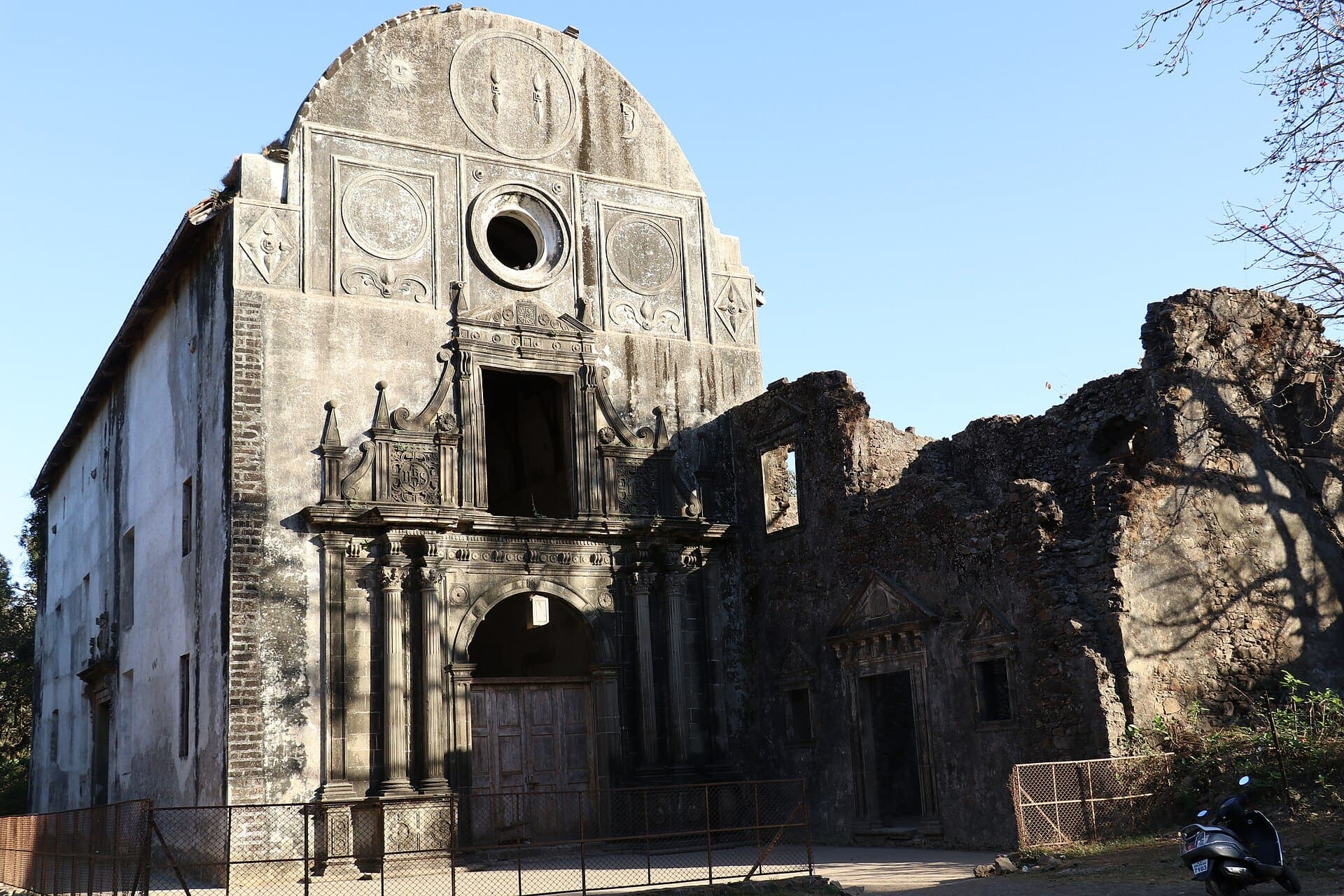 The roofless stone facade of a Portuguese church inside Vasai Fort